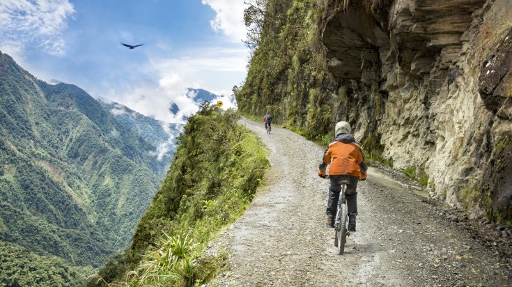 Tourists ride the "Death Road" in the Yungas of Bolivia in July.