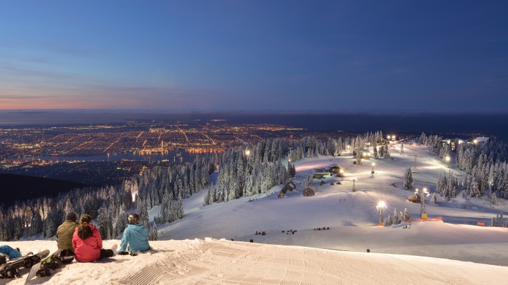 People enjoying the view of the city from Grouse Mountain in Canada in February..