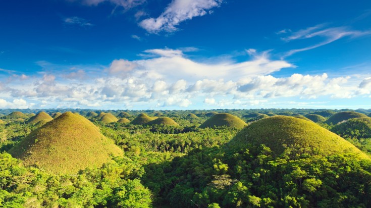 Wide view of The Chocolate Hills in Bohol in the Philippines on a sunny day