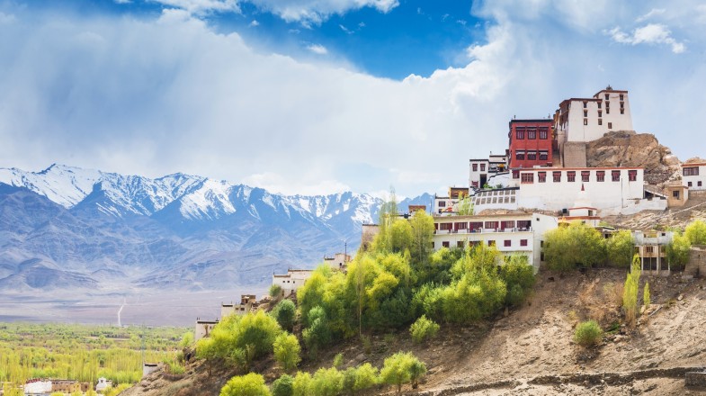 View of white colored building on top of a hill
