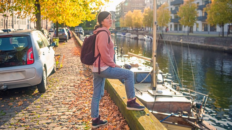 A woman walking the empty streets of Denmark in September.