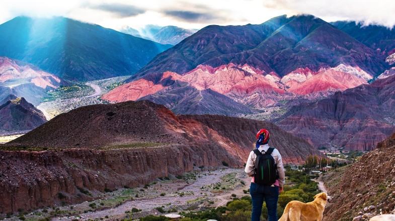 A trekker girl with her dog admiring the landscapes of the country during her 2 weeks in Argentina.