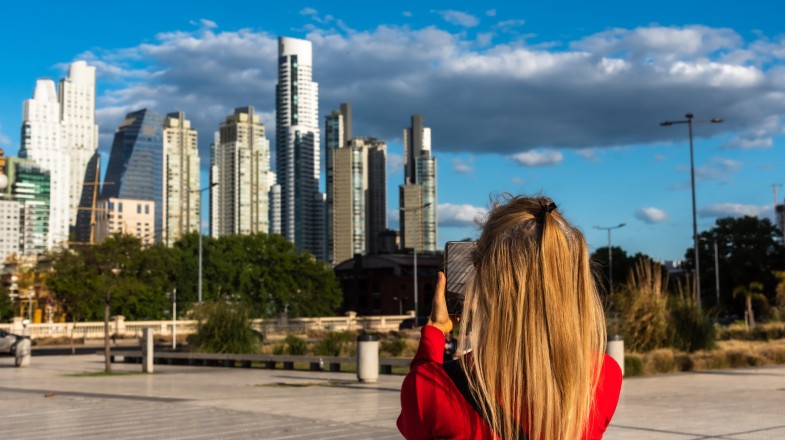 A tourist girl takes photos during her sightseeing tour in Buenos Aires on her 6 days in Argentina tour.