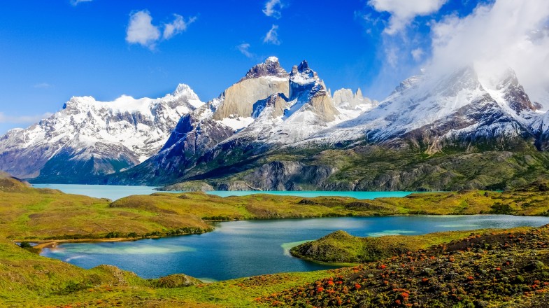 Chile in November offers a unique opportunity to witness nature's vibrant transformation, making it the perfect time to explore this captivating land. Beautiful landscape of Andes mountain range, winding road, and lake at Torres del Paine National Park in Chile in November.