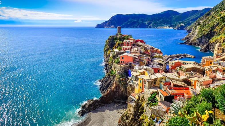 Experience the Mediterranean like never before from the coast of  Cinque Terre in Italy during June. Scenic view of colorful village Vernessa and ocean coast in Cinque Terre of Italy in June.