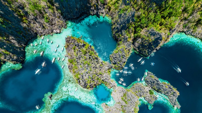 Aerial view of Coron Island and its deep blue waters during your 8 days in the Philippines.