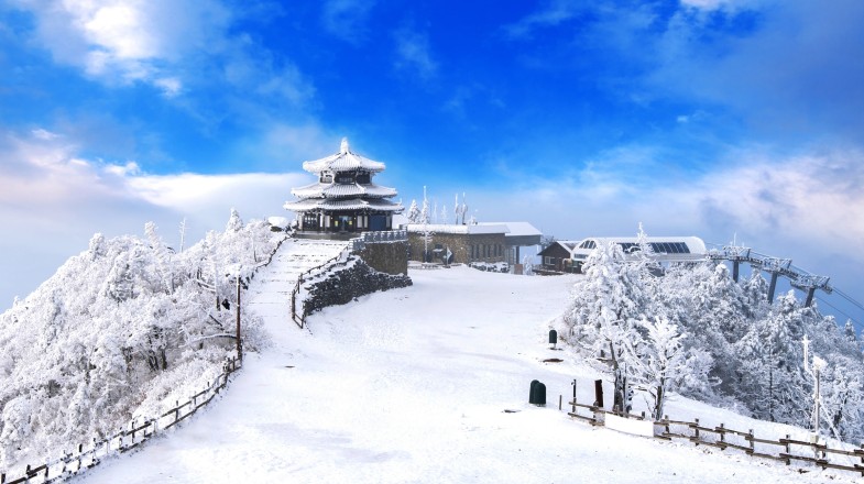 Deogyusan mountains are covered with snow and morning fog during winter in South Korea.