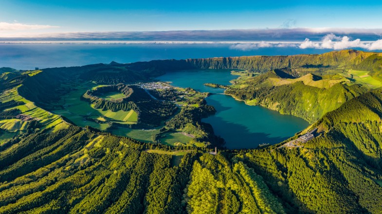 A lush island made of volcanic crater with two lakes in the middle.
