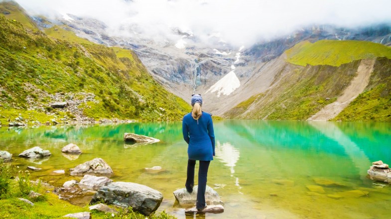 A woman enjoying the scenery of Humantay Lake in Peru