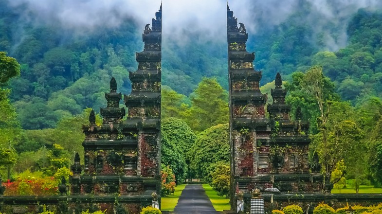 Gates to one of the Hindu temples in Bali with gloomy clouds in Indonesia in October.