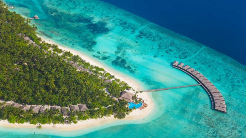 Aerial view of island in Maldives; best time to visit Maldives