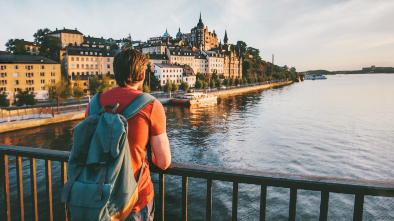 A man admiring the view of Stockholm, one of the best places to visit in Sweden during dusk.