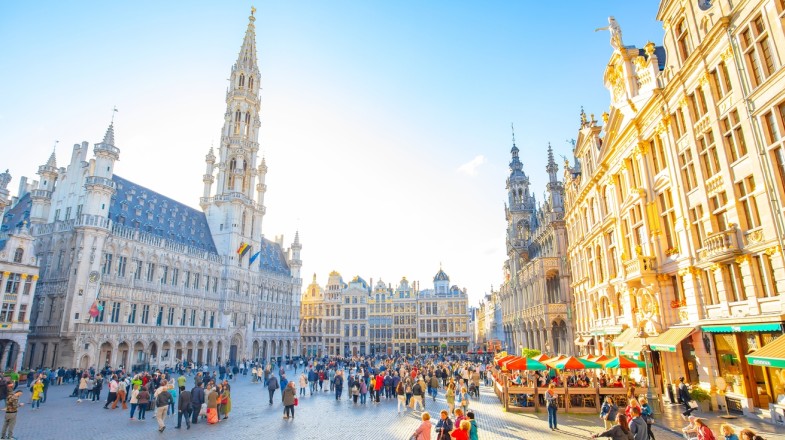 Include visiting the Grand Place square while planning a trip to Belgium.