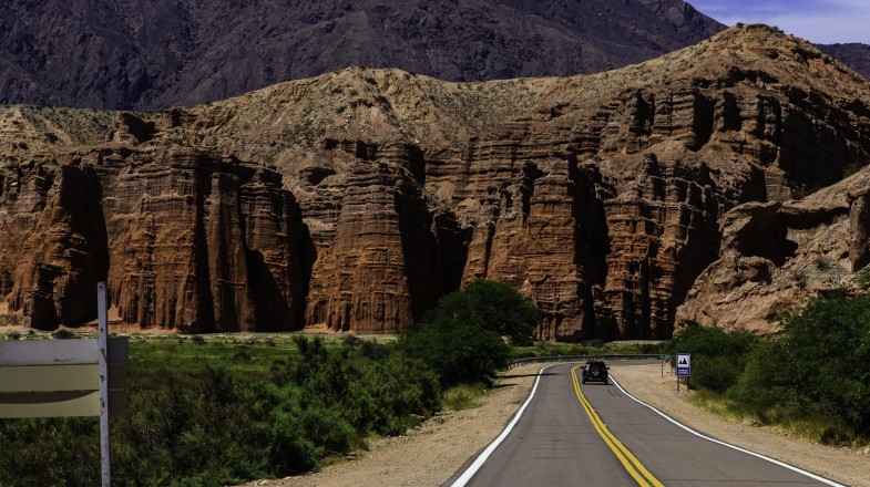 Quebrada de Cafayate is a deep canyon framed by extraordinary rock walls showcasing layers of stunning colors, from deep red to vivid green to cobalt blue.