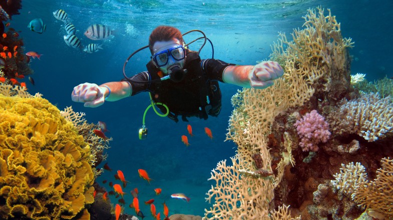 A happy man scuba diving in Israel in February.