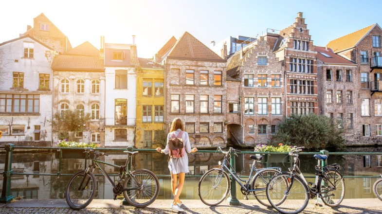 Cycling through the canal of Ghent to explore the city is one of the best things to do in Belgium.