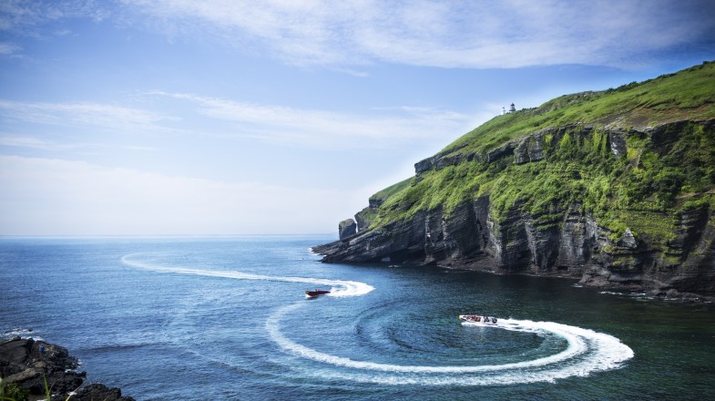 Two boats making patterns in Jeju Island in South Korea in June.