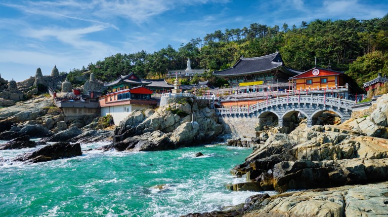 Haedong Yonggungsa Temple on sea shore during summer in South Korea.