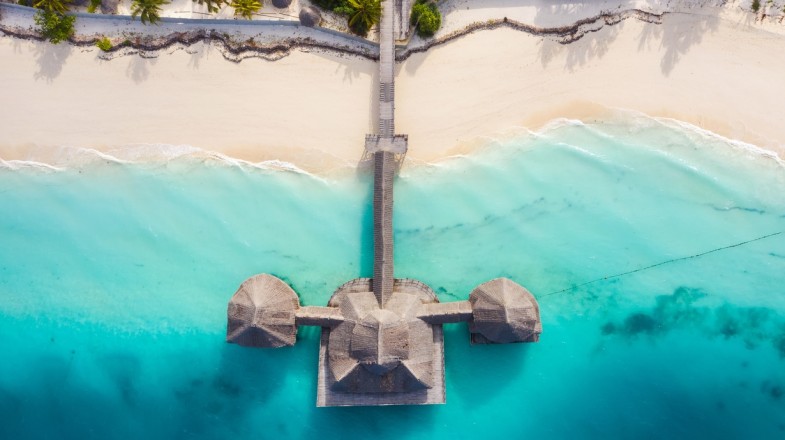 A beach resort built on the shorelines of blue sea water in Tanzania in November.