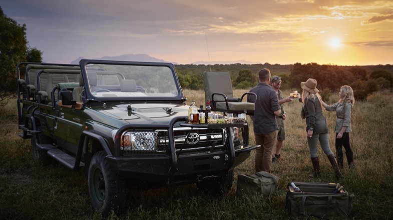 A group of tourists enjoying game drives and safaris while spending 10 days in South Africa.