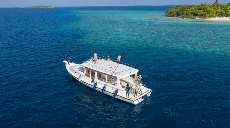 Tourists fishing in Raa Atol while on a yacht in the Maldives in December.