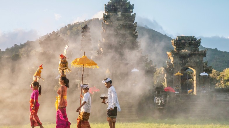 People making a religious offering in winter in Indonesia.