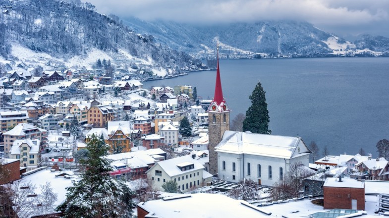 See the roofs in Weggis village covered in snow in Switzerland in February.